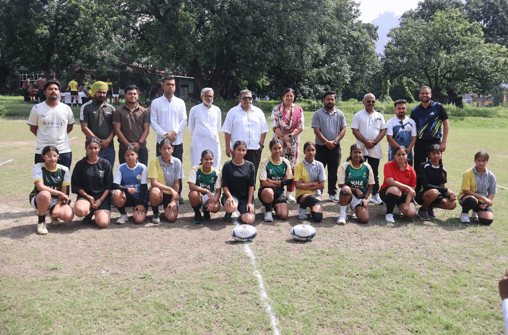 Rugby Uttarakhand state squad and coaching staff on pitch at Kotdwar